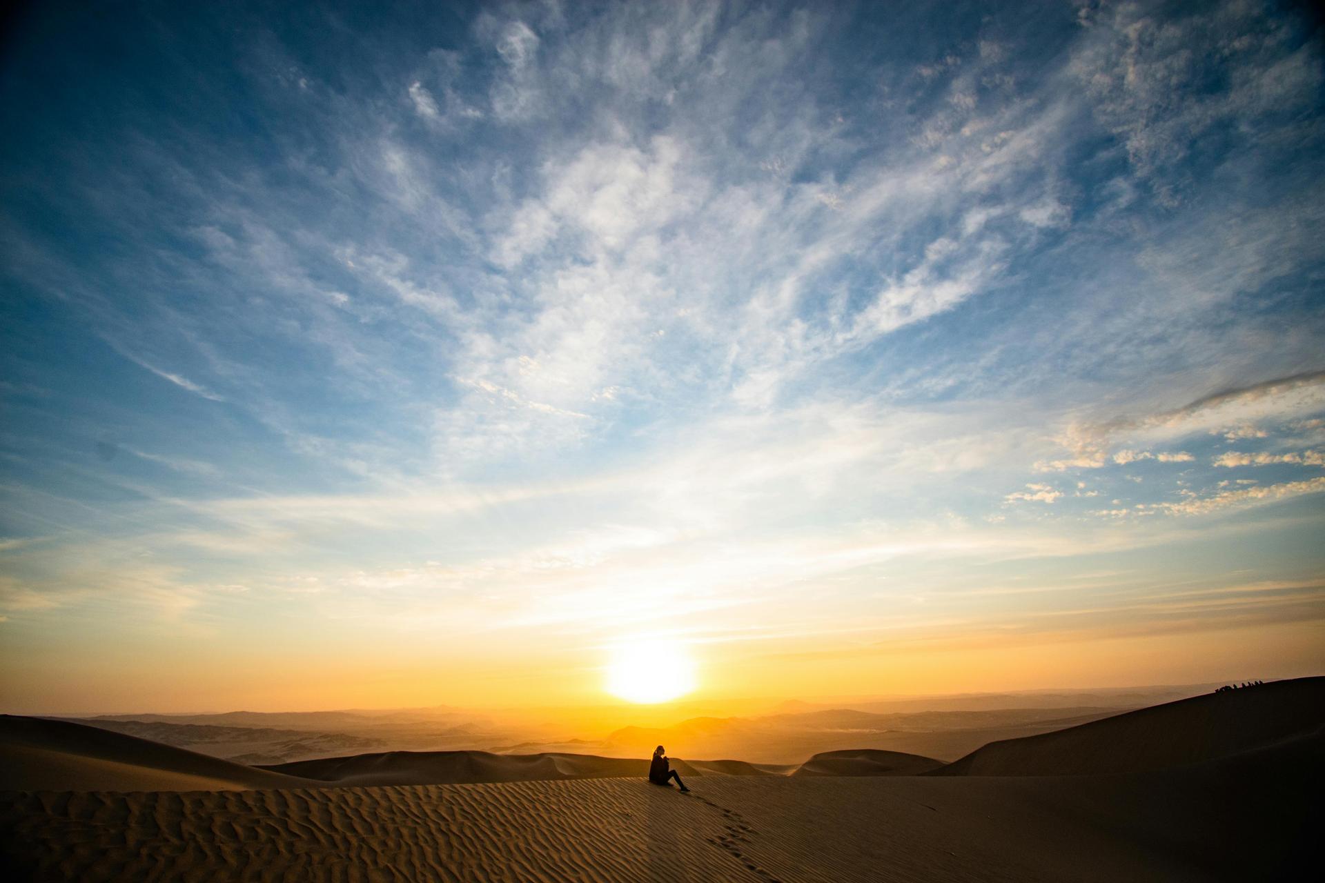 Sunrise Over Desert Dunes
