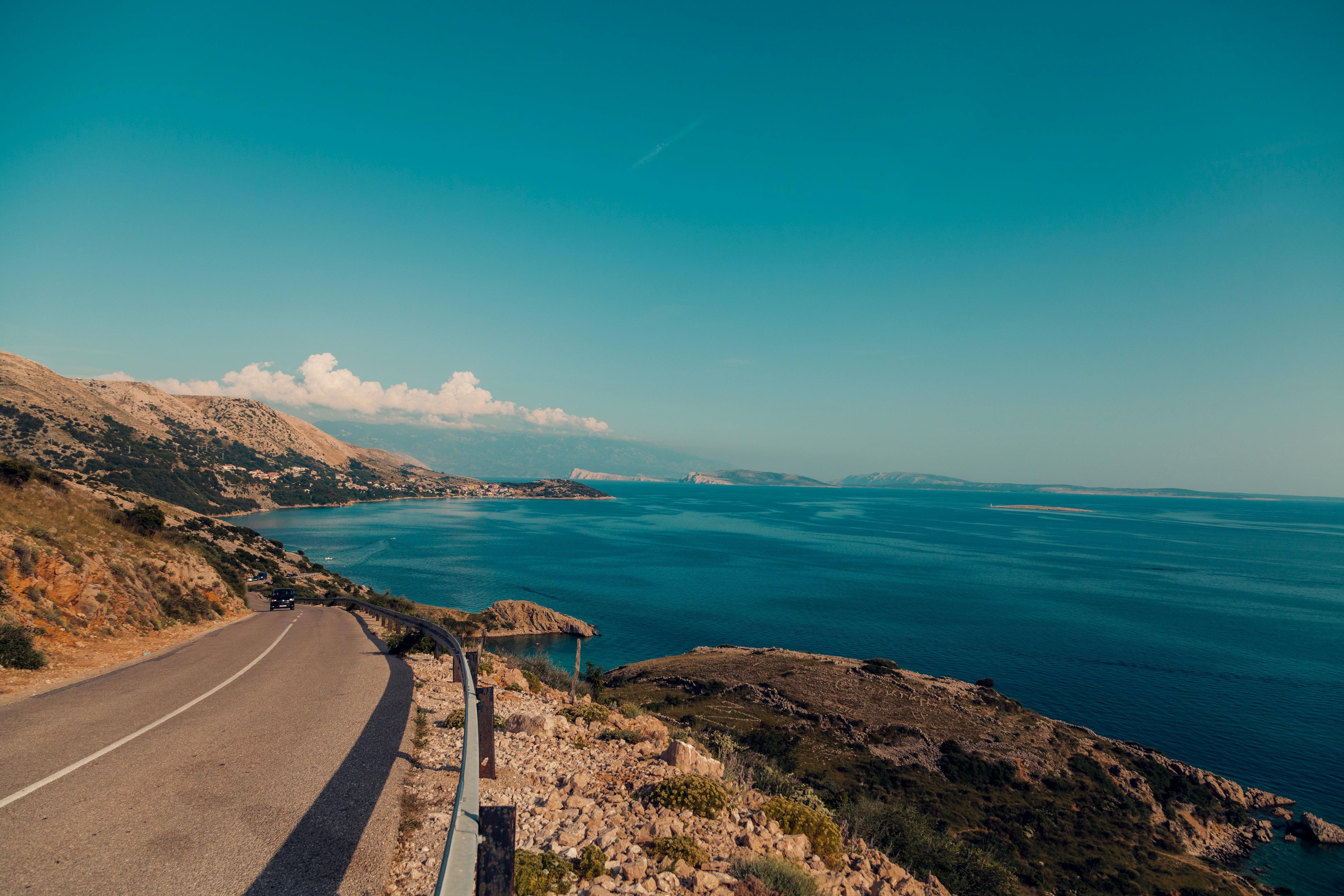 Scenic mountain road winding through Jabel Jais with dramatic rock formations