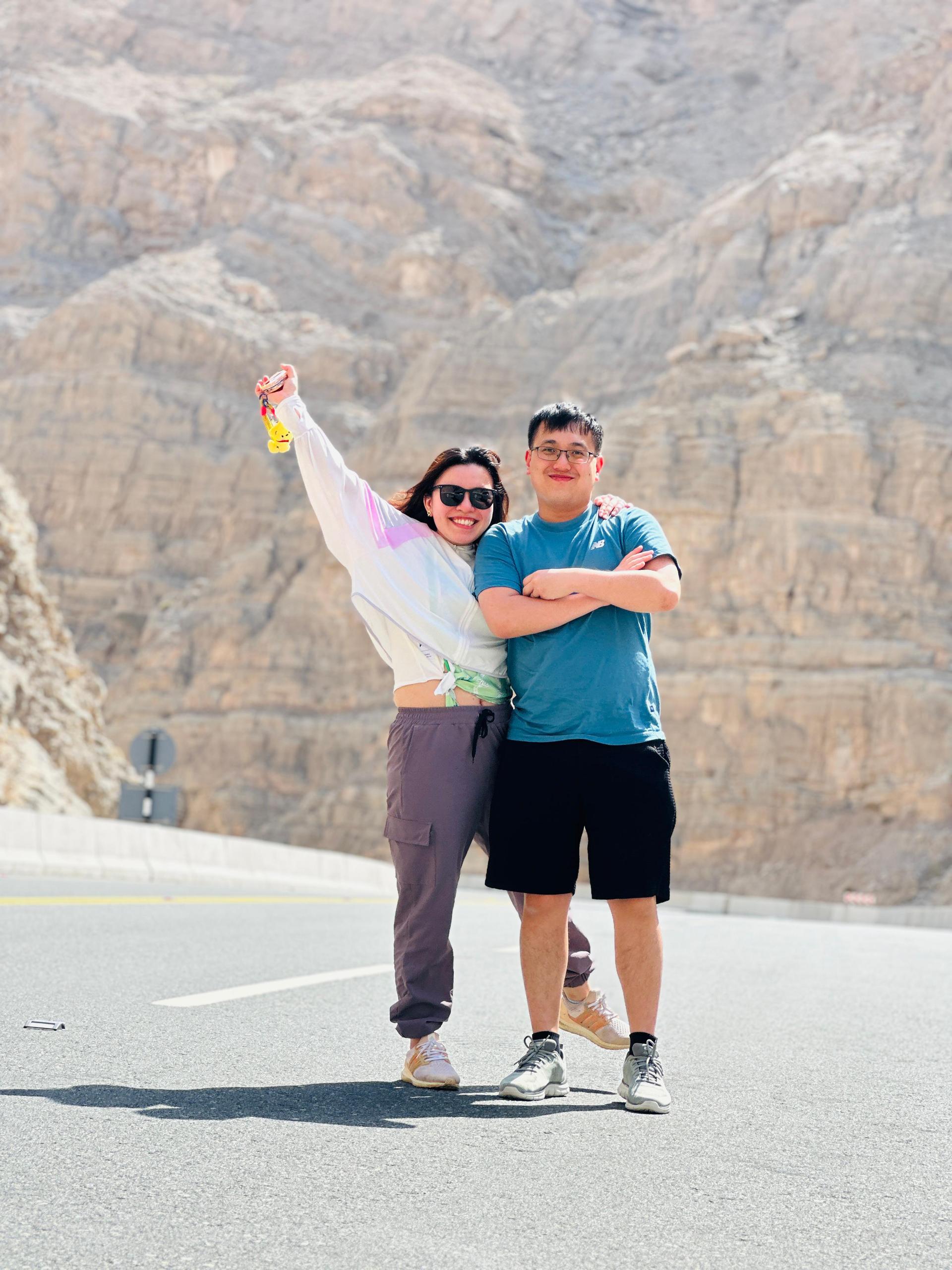 Couple posing at Jebel Jais mountain viewpoint during Dubai day tour