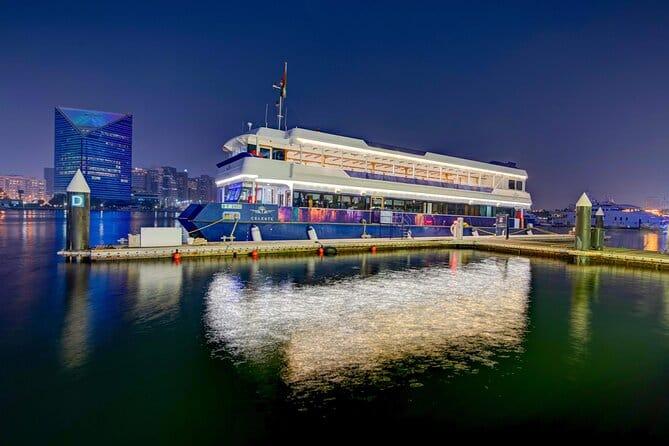 Celeste luxury cruise boat illuminated on Dubai Marina waters at night