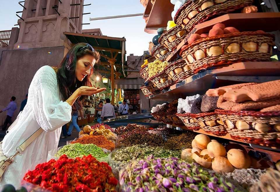 Traditional souk market with colourful lanterns and textiles in Old Dubai