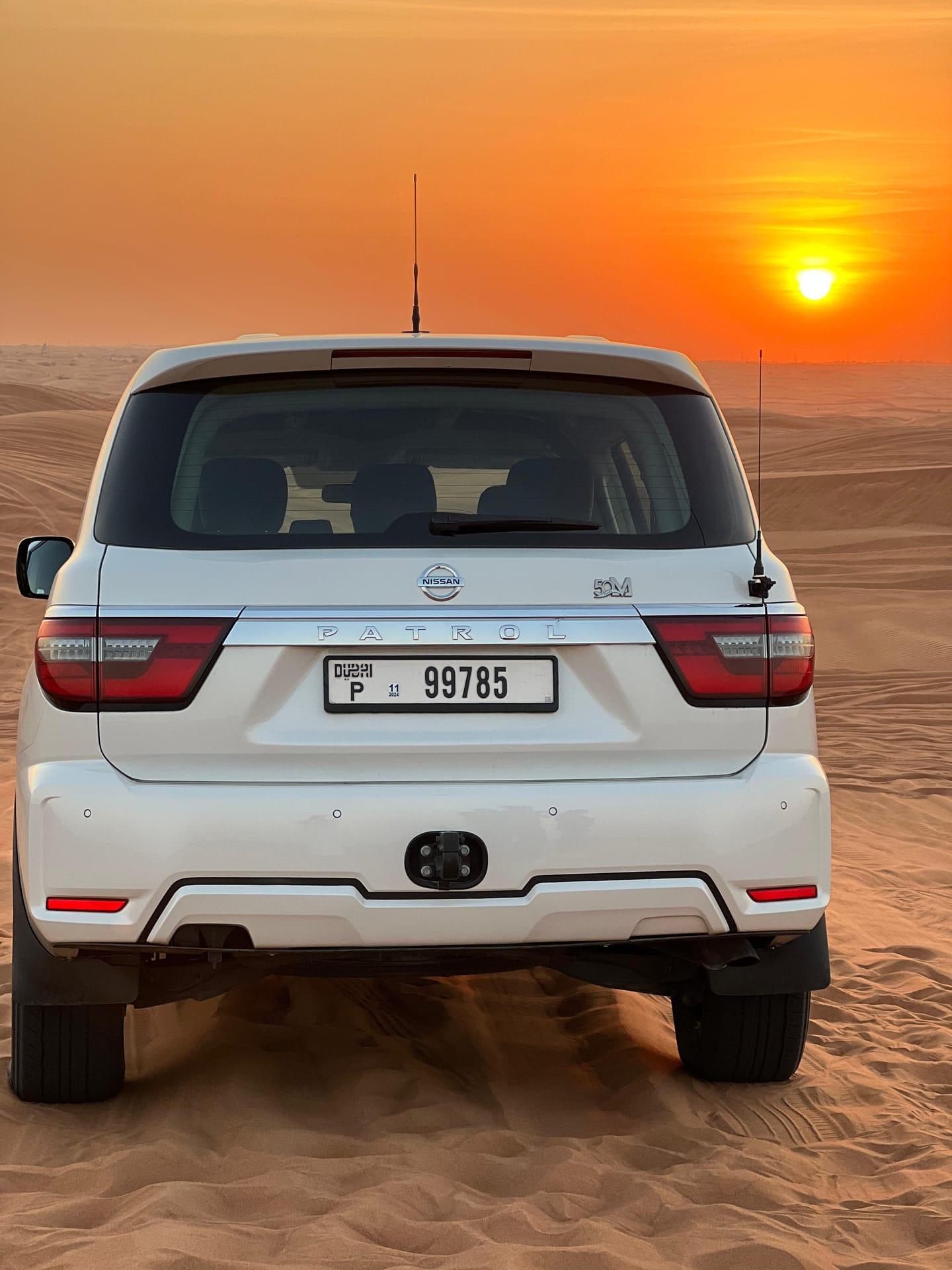 Toyota Land Cruiser 4x4 parked in Dubai desert ready for dune bashing