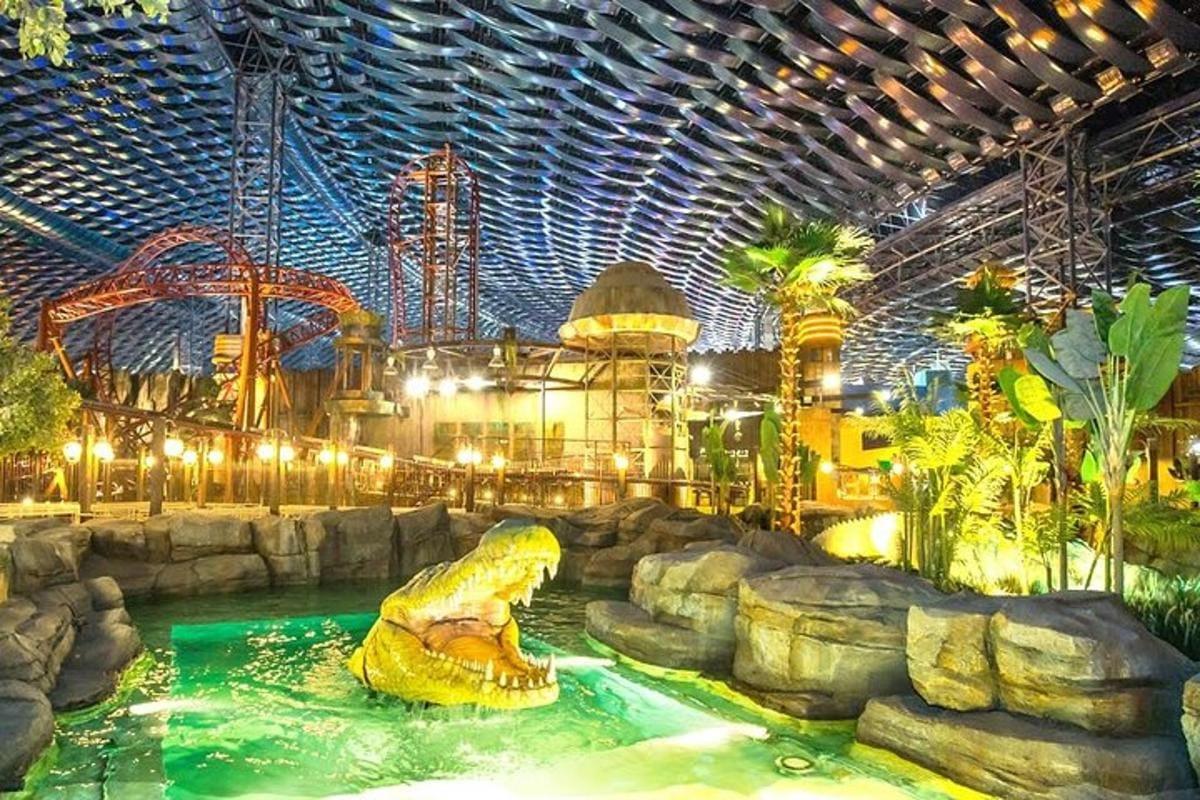 Dinosaur themed area with green lighting at IMG Worlds of Adventure Dubai