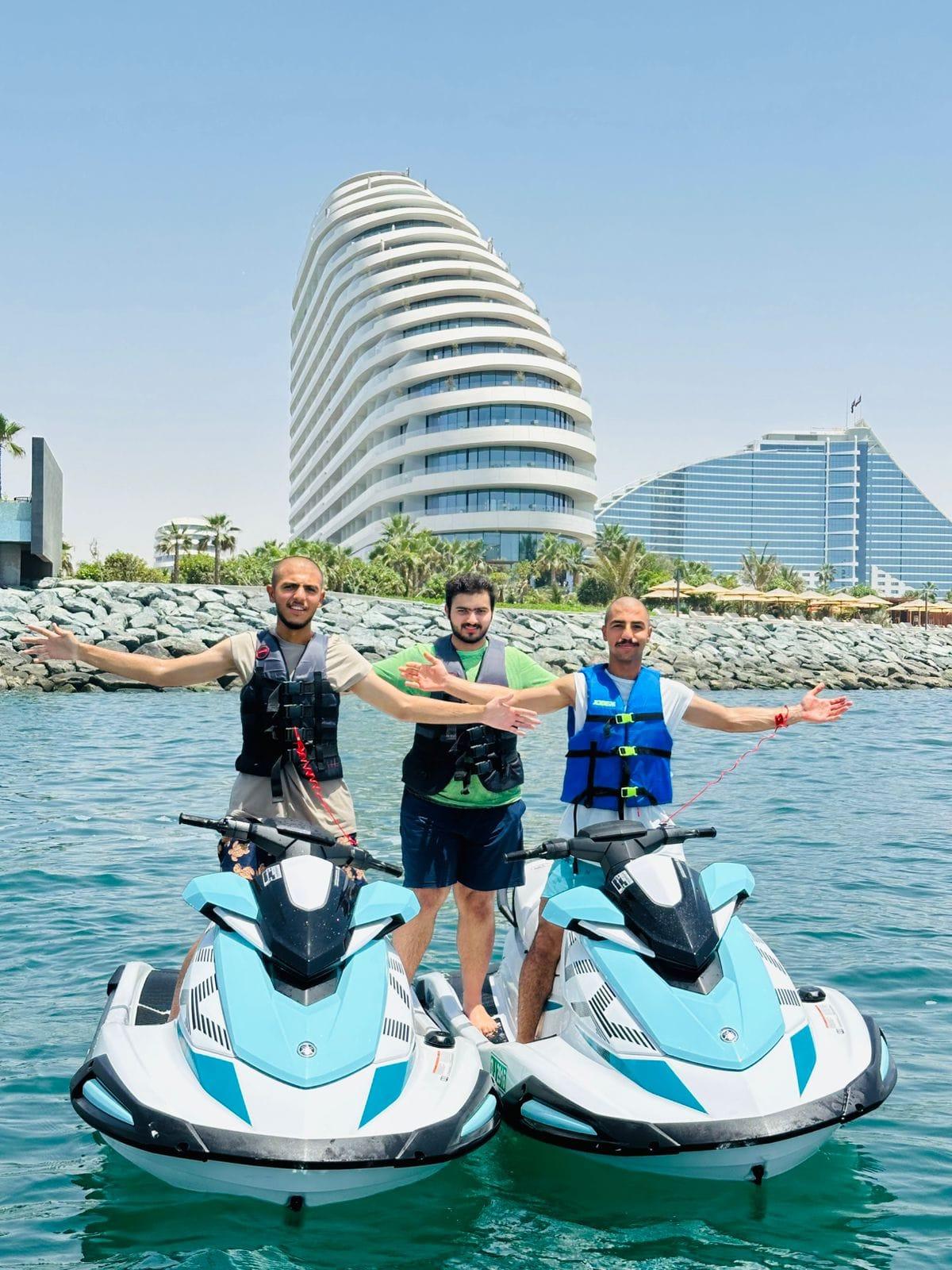Couple on jetski with Burj Al Arab in background during Dubai water adventure
