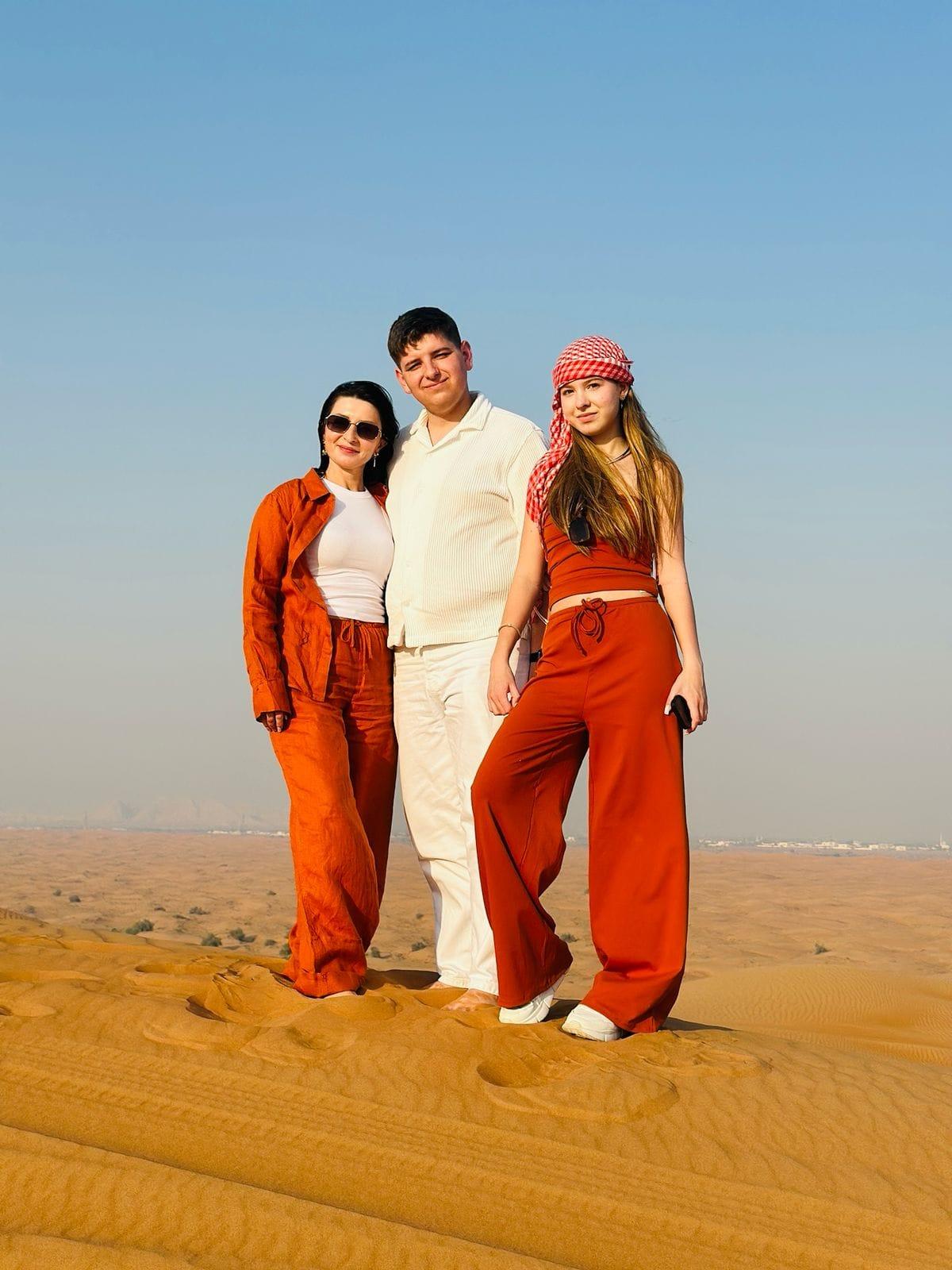Family posing together at luxury desert camp during private safari Dubai