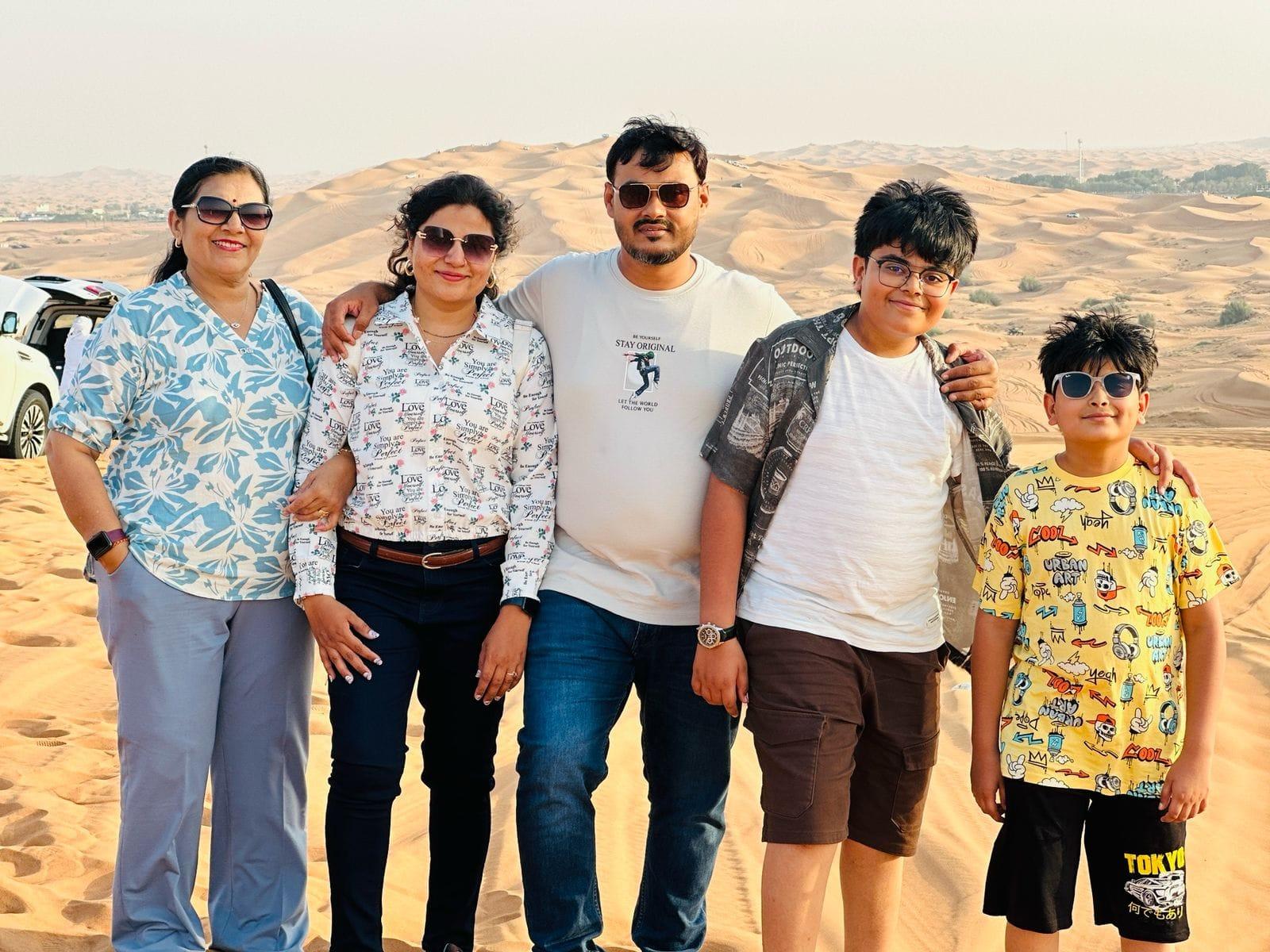 Couple enjoying desert sunset during premium safari experience Dubai