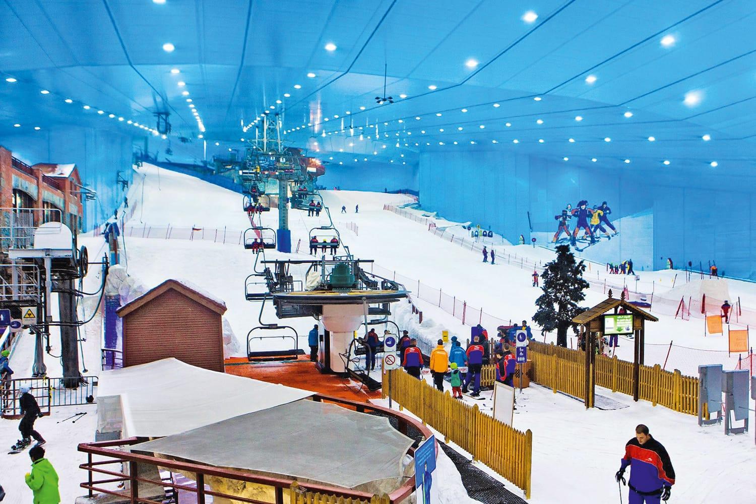Visitors enjoying snow activities at indoor snow park Ski Dubai
