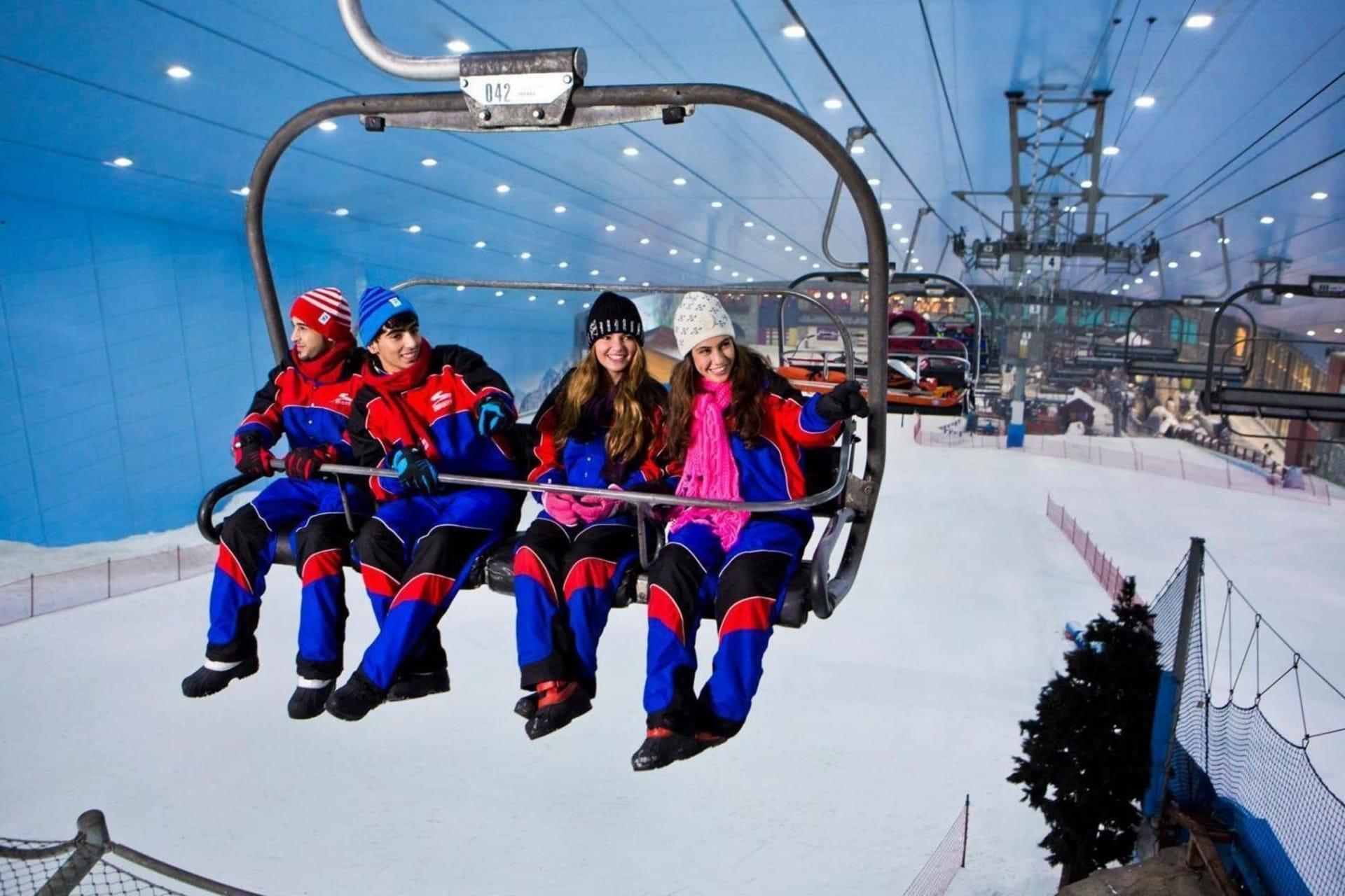 Family in winter gear at indoor snow park adventure Dubai